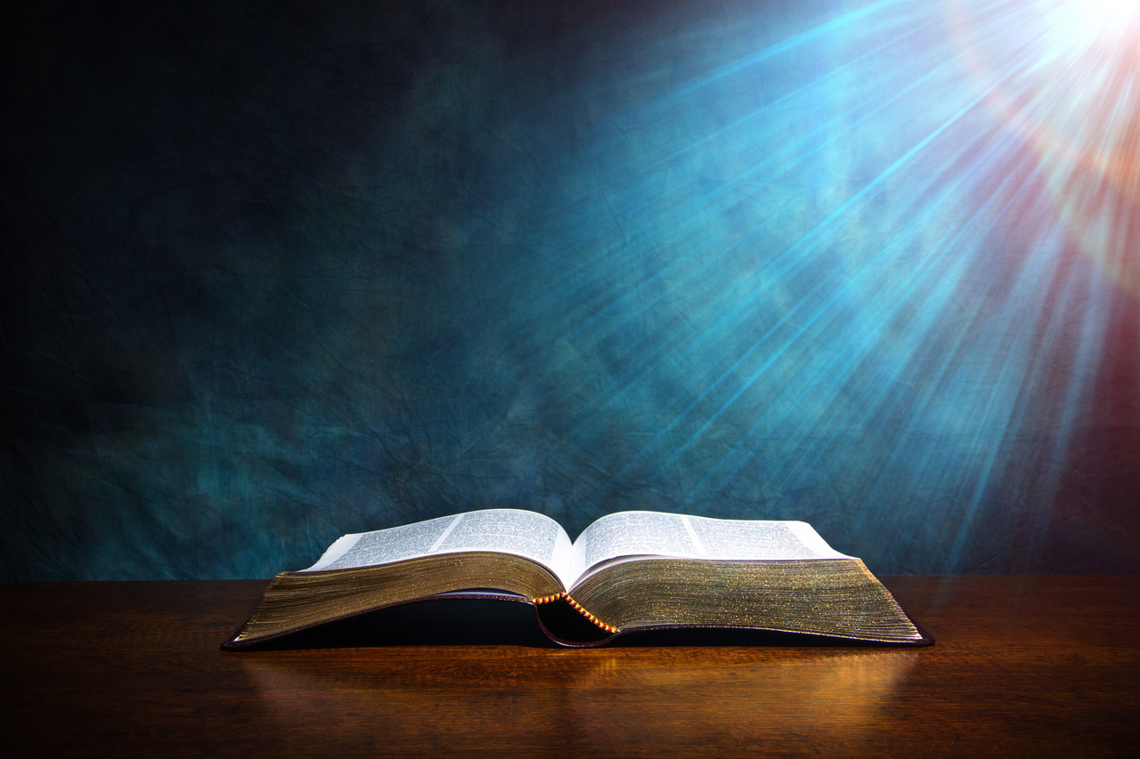 The Holy Word is illuminated by a ray of sunlight, guiding the Christian lifestyle with divine wisdom.
