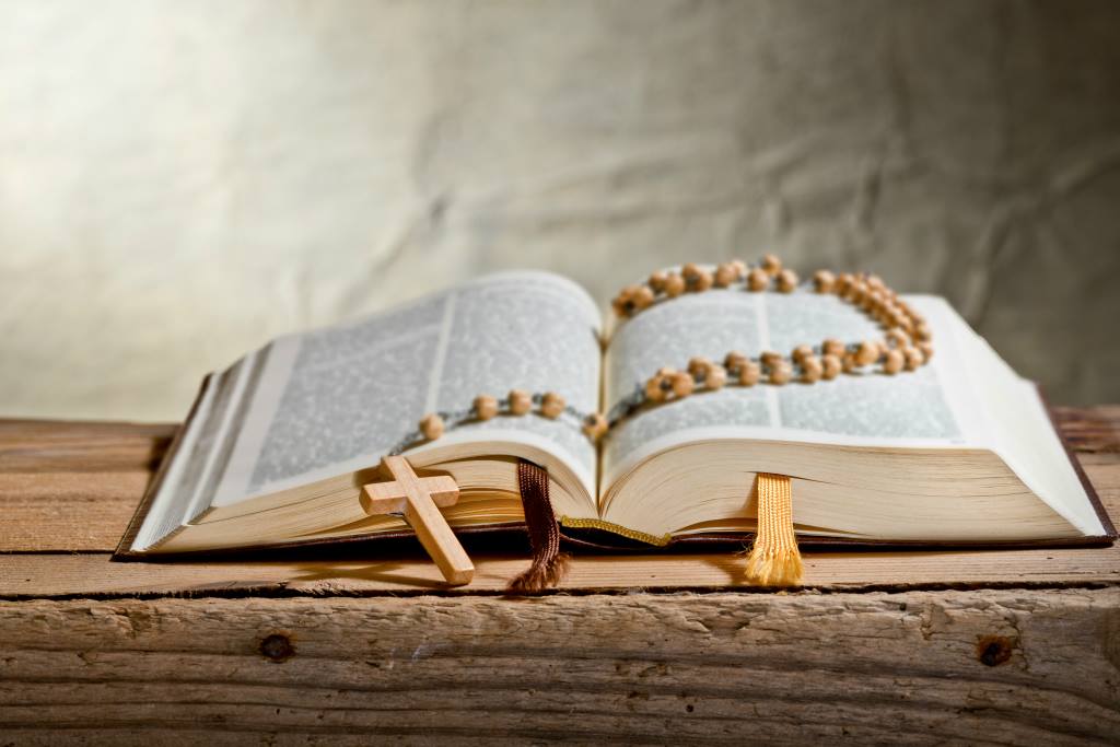 The Bible and Rosary symbolize meaningful life lessons and spiritual guidance.